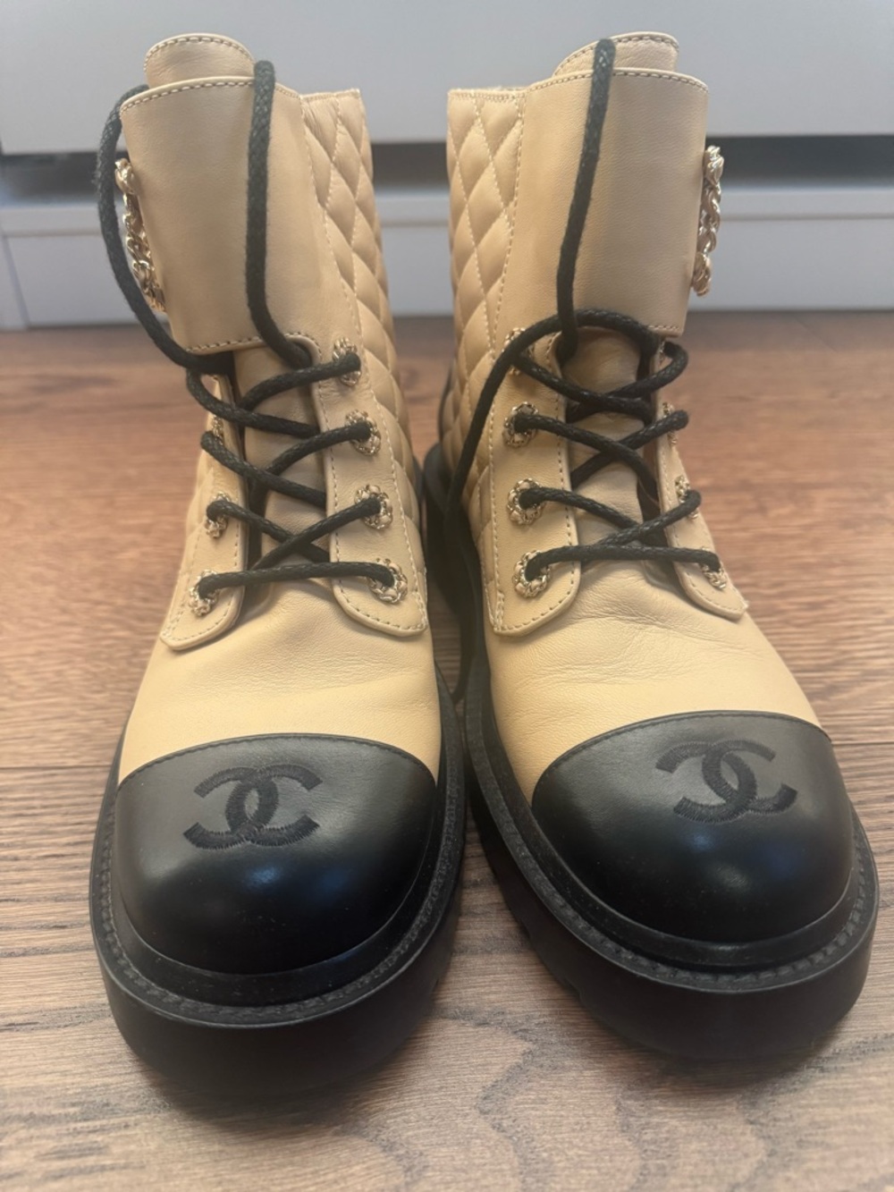 CHANEL Two-Tone Quilted Combat Boots in Beige and Black
